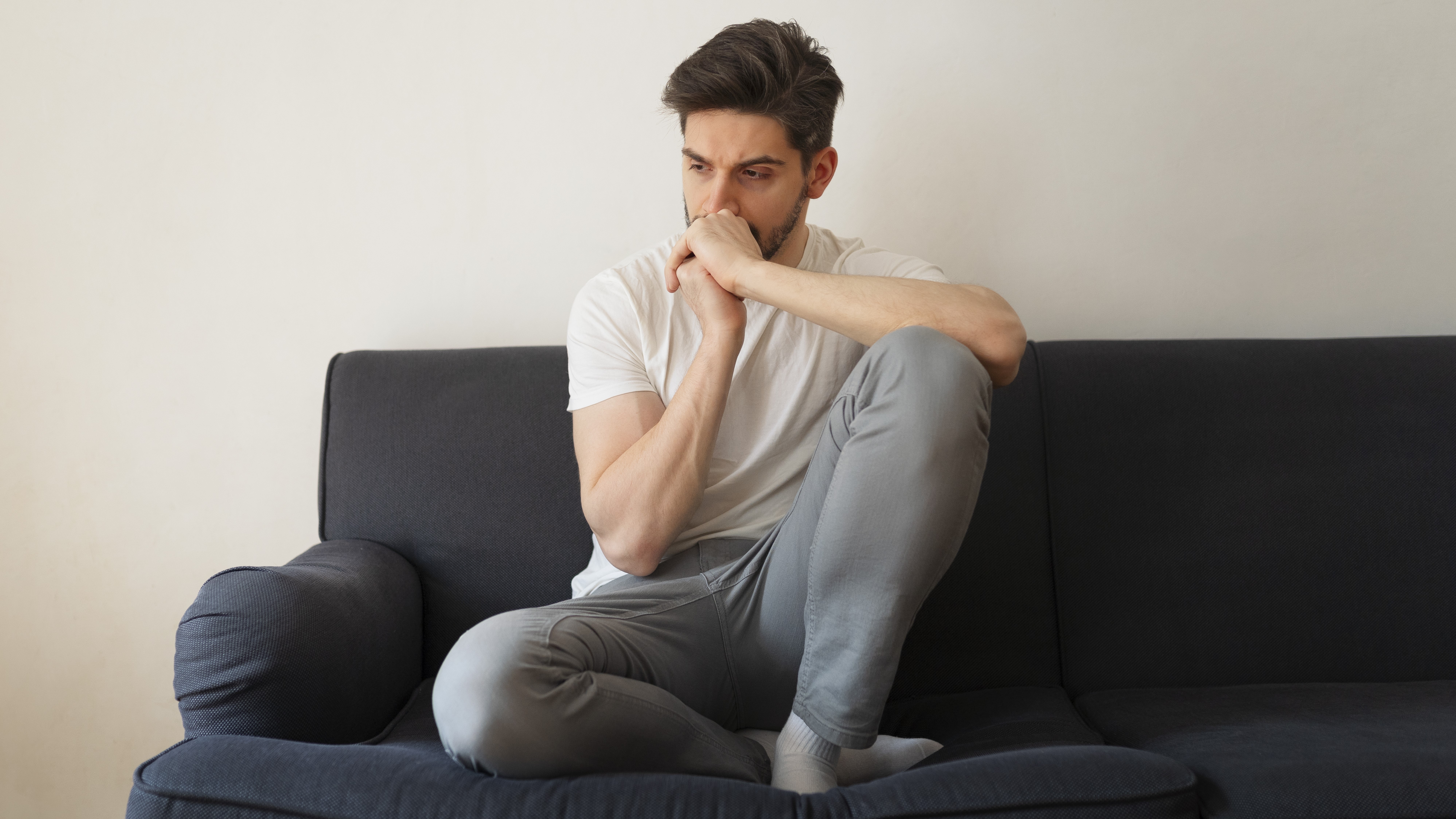 full-shot-man-sitting-couch